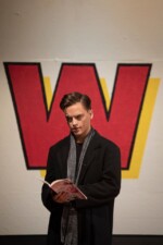 JD reading a book on set for Heathers