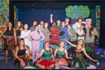 Group shot of cast of Peter Pan in full costume and character