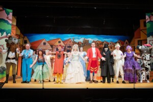 The cast of Jack and The Beanstalk on stage for their curtain call in full costume.