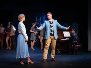 Peggy Sawyer (Aleisha Archer) enters the audition and speaks to Billy (Kyan Matthews)